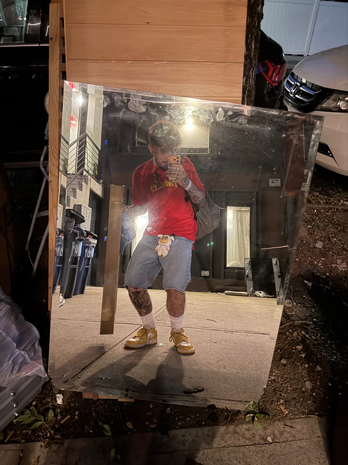 Andres taking a full-length mirror photo outdoors