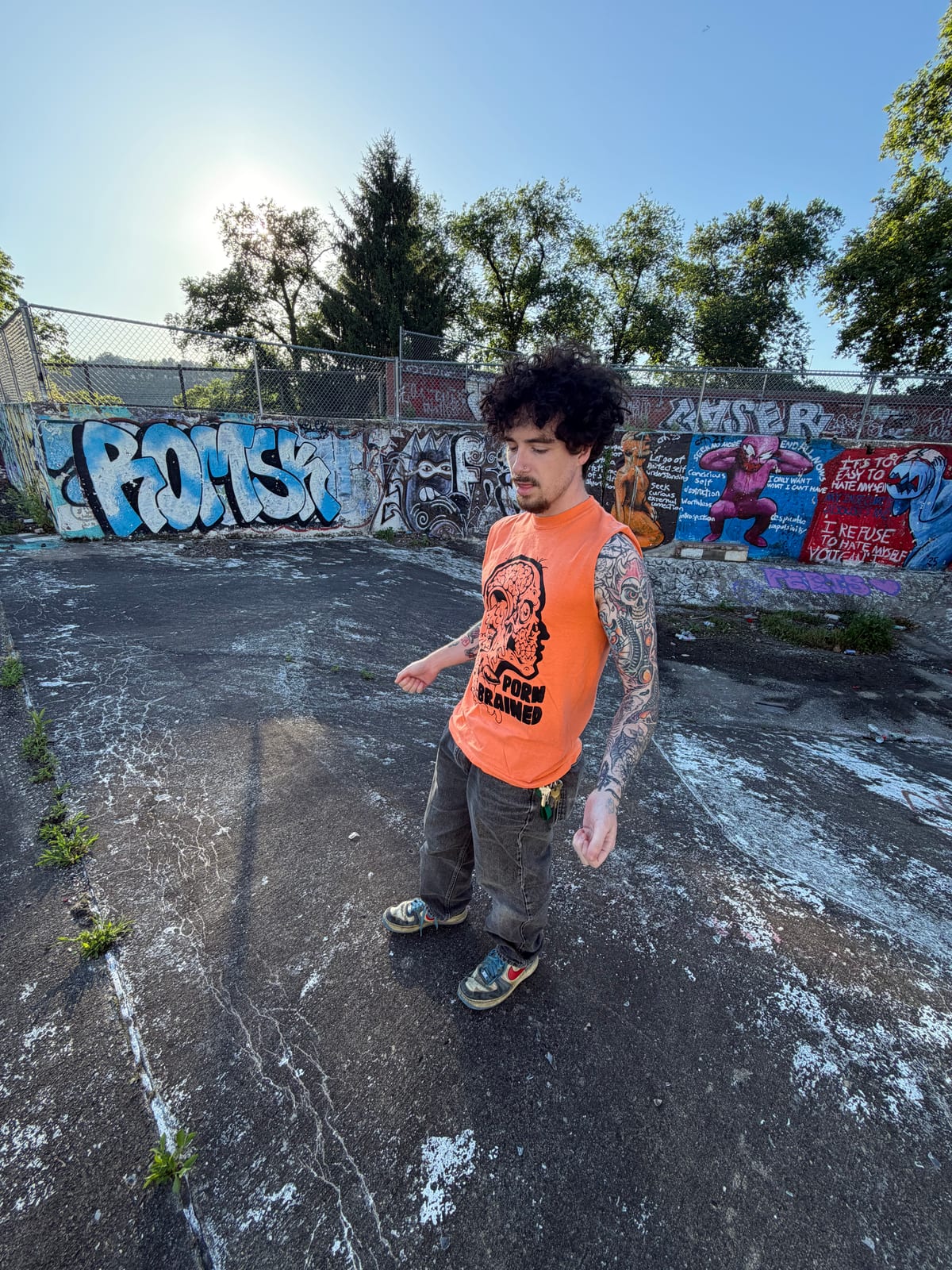 Clay standing at an outdoor graffiti spot